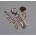 A Sampson Mordan silver 'man-in-the-moon' combination bookmark and magnifying glass and two other