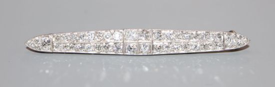 An early 20th century '15ct & Pt', diamond set twin row bar brooch, 57mm.