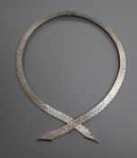 A 1960's textured 9ct white gold necklace with twin arrow terminals, 50cm.