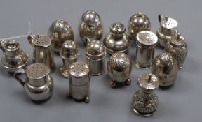 A pair of silver weighted egg-shaped 'cayenne' and 'pepper' pots, crested and fourteen other