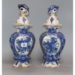 A pair of late 18th century Dutch delft lidded vases and covers (a.f.) height 35cm