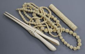 A 19th century Chinese export ivory bodkin case, three ivory bead necklaces and a pair of ivory