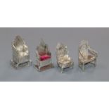 Four early 20th century miniature silver/white metal chairs, one a pincushion, one modelled as the