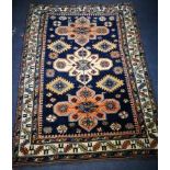 A Caucasian Shirvan blue ground rug 157 x 112cm