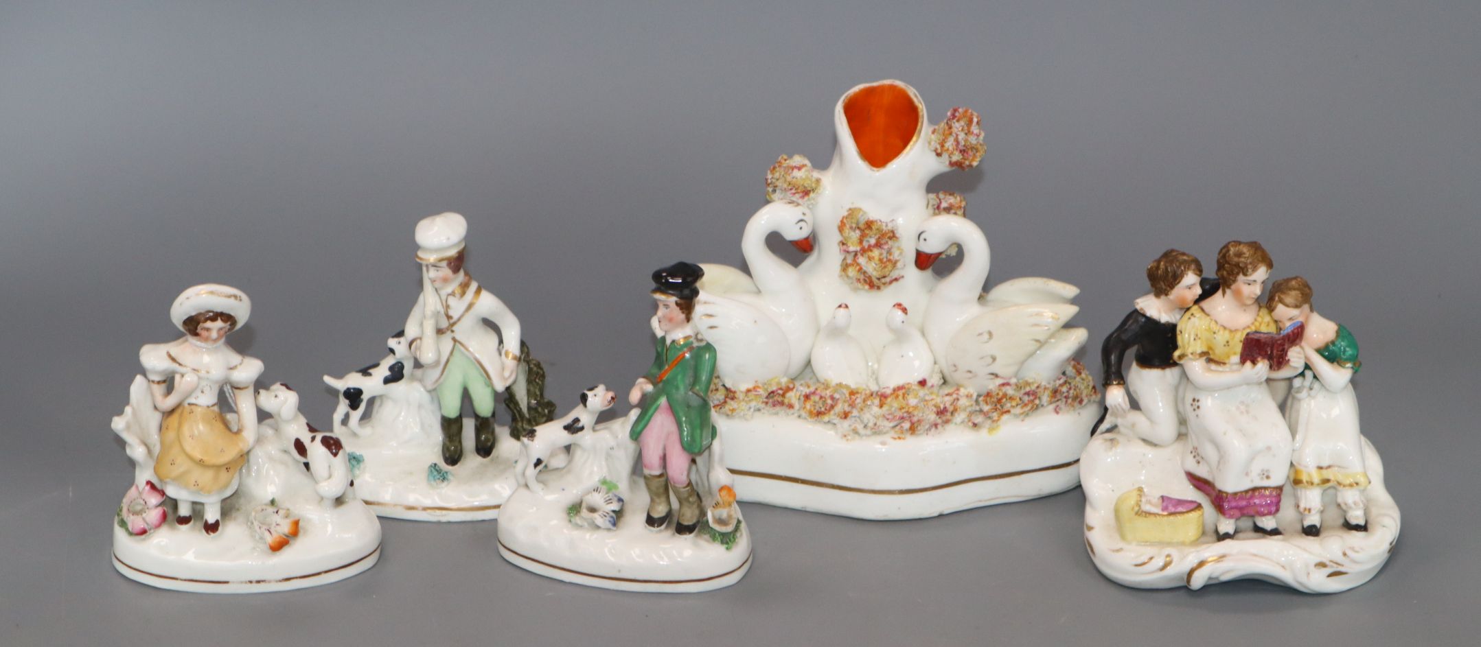 Three Staffordshire porcelain toy groups and two other groups, c.1830-50, including a pair with