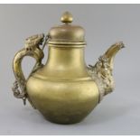 A 19th century Tibetan brass and silver overlaid teapot zoomorphic spout and dragon handle, H.