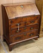 An early 18th century herringbone crossbanded walnut bureau (a.f.) W.76cm