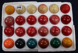 A set of snooker balls, some ivory