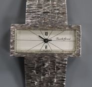 A lady's 9ct white gold Bueche Girod wrist watch with textured 9ct gold integral bracelet.
