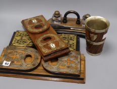Three Victorian book slides, an ink stand and a beaker