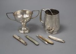 A George V silver christening cup, a white metal small trophy cup and four silver and mother of