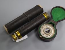 A pocket barometer, thermometer and compass in leather case and a gilt brass three-draw telescope