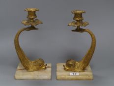 A pair of 19th century ormolu 'dolphin' candlesticks, later onyx bases