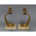 A pair of 19th century ormolu 'dolphin' candlesticks, later onyx bases