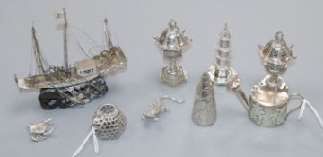 A collection of Chinese novelty white metal items, including a miniature watering can cast with