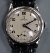 A gentleman's 1930's stainless steel Omega manual wind mid-size wrist watch, with Arabic dial and