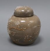 A Chinese crackle-glazed mushroom ground ginger jar and cover with prunus slip decoration