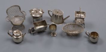 A group of novelty miniature silver and white metal items, including a basket on stand with pseudo