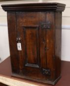 A small 20th century oak hanging corner cabinet W.60cm