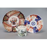 A Japanese porcelain teapot and two Imari dishes largest diameter 28cm