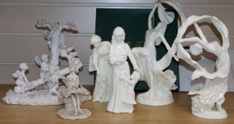 A group of blanc de chine figures, including a Belleek lithophane plaque, 'The Water Carrier' (