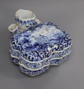 An 18th century Dutch Delft two-section blue and white ink pot and cover, having removable pierced