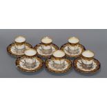 A set of six Aynsley silver mounted porcelain coffee cans and saucers