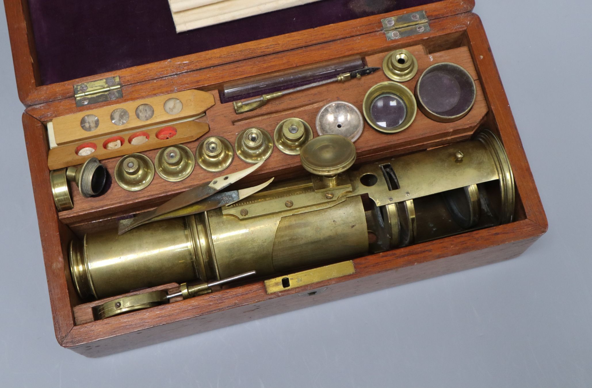 An 18th century brass Culpepper type monocular microscope, together with interchangeable lenses