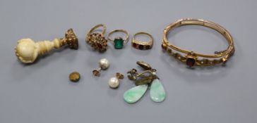 A Victorian 9ct and gem set bangle a.f., an ivory mounted seal, three gem set rings including 9ct