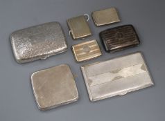 An engraved silver cigar case, three silver cigarette cases and three match cases, some engine-