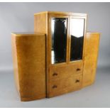 An Art Deco birds eye maple display cabinet and similar dining table, the table with rectangular top