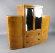 An Art Deco birds eye maple display cabinet and similar dining table, the table with rectangular top