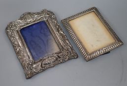 Two early 20th century silver mounted photograph frames, largest 22cm.