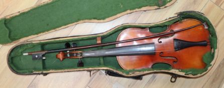 A German three-quarter size violin and bow, cased