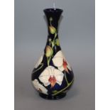 A Moorcroft Chatsworth Orchid bottle vase, seconds limited edition 377/350 height 23cm