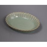 A Chinese celadon glazed dish length 18.5cm