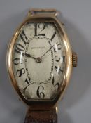 A stylish 1930's? yellow metal Movado manual wind wrist watch, with tumbling numerals, (a.f.), on