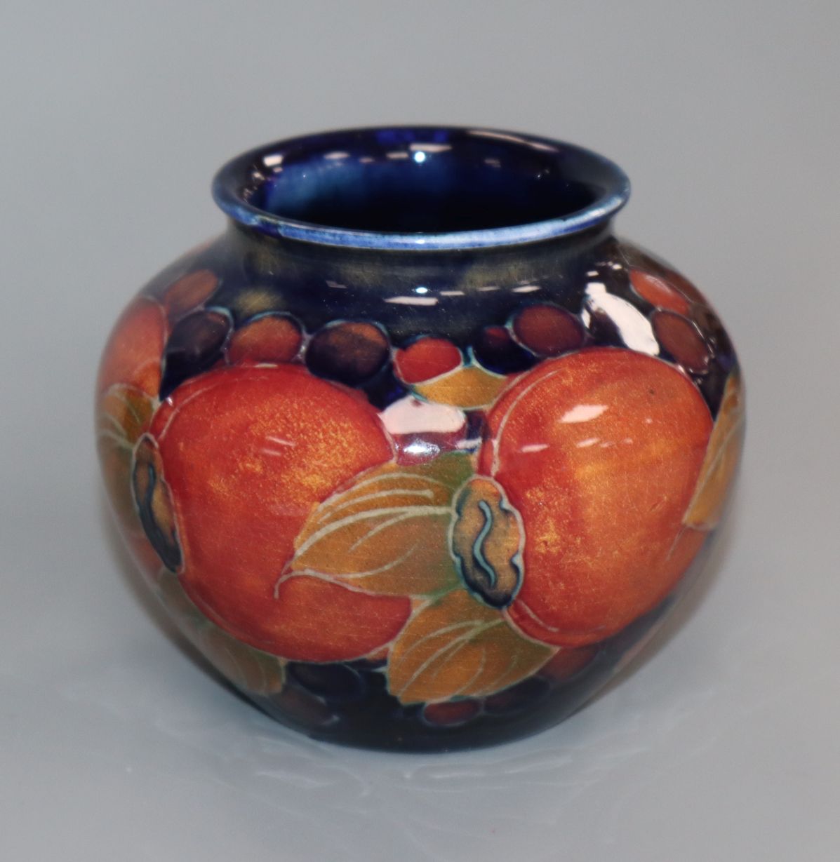 A Moorcroft pomegranate small pot H.7cm