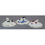 Three Staffordshire porcelain figures of King Charles Spaniels, c.1835-50, on scrollwork bases, each