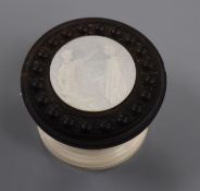A late 19th century turned rosewood and carved ivory ornament Diameter 6.8cm