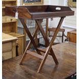 A mahogany butler's tray on associated stand Tray 80cm wide