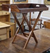 A mahogany butler's tray on associated stand Tray 80cm wide