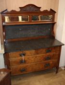 A late Victorian walnut washstand, with black marble top and splash back W.118cm