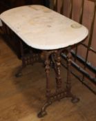 A Victorian cast iron marble top garden table