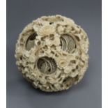 A large Chinese ivory concentric ball H.12cm
