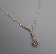 An Edwardian style yellow metal, blue topaz, diamond and seed pearl set drop pendant necklace,