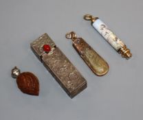 A Stanhope 'walnut' pendant, an enamelled propelling pencil, a hardstone pendant and a lipstick