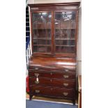 A George IV mahogany cylinder bureau bookcase W.106cm