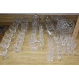 A part suite of table glasses, a set of four painted brandy balloons and various cut glass items,