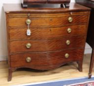 A mahogany serpentine chest of drawers, stamped H Mawerx Stephenson, London W.101cm